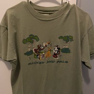 Olive green size large, fits more like a medium. Mickey and pals embroidery.